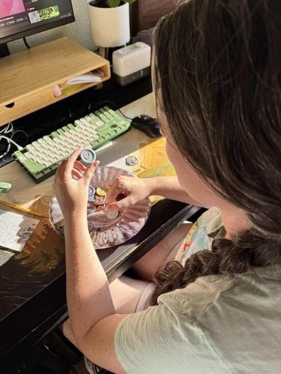 Jenna making a wax seal at her desk